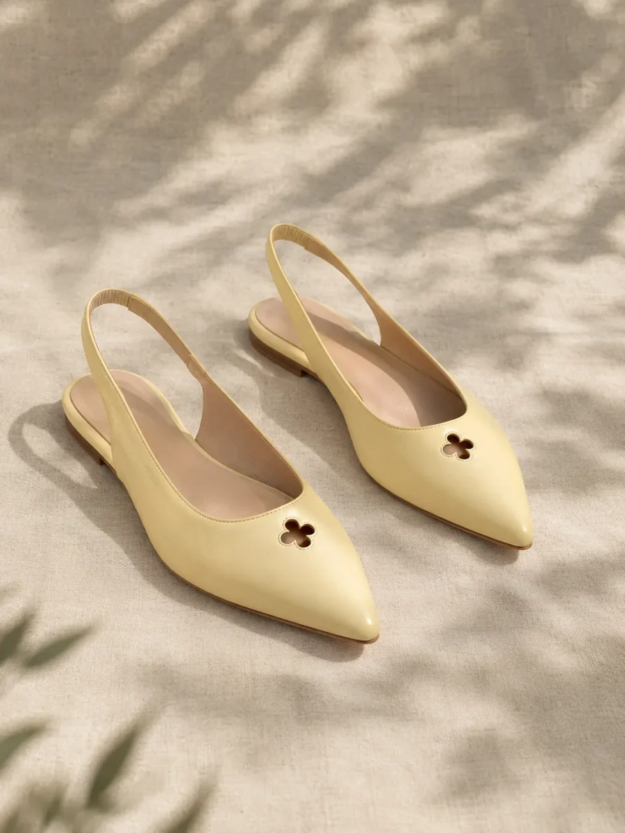 Clover Slingback Flat in butter yellow, pair seen from the front